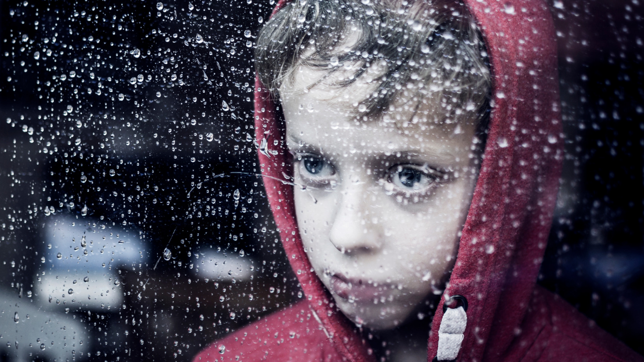 boy with weather anxiety in a storm